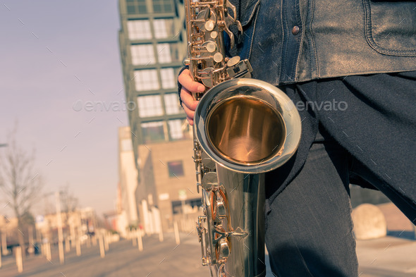 Detail of a young woman with her saxophone (Misc) Photo Download