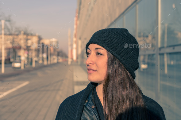 Beautiful young woman posing in the city streets (Misc) Photo Download