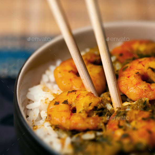 Curry prawns shrimp and rice in a bowl Caribbean food
