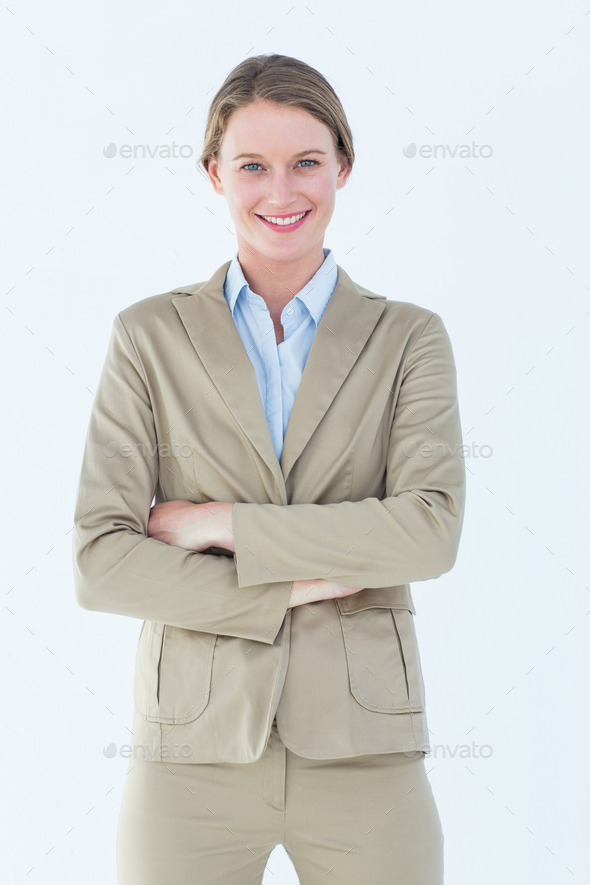 Businesswoman in suit smiling at camera on white background (Misc) Photo Download