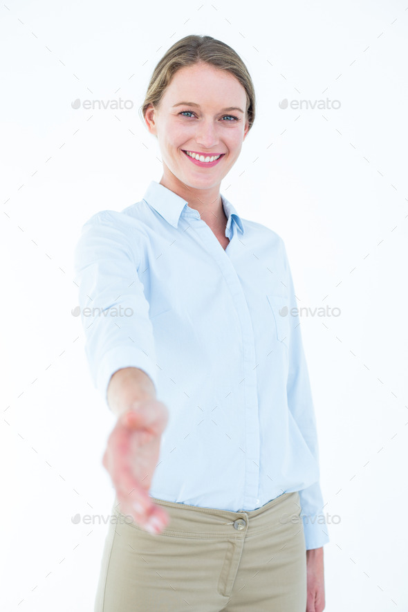 Smiling businesswoman offering handshake on white background (Misc) Photo Download