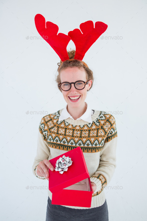 Happy geeky hipster opening present on white background (Misc) Photo Download