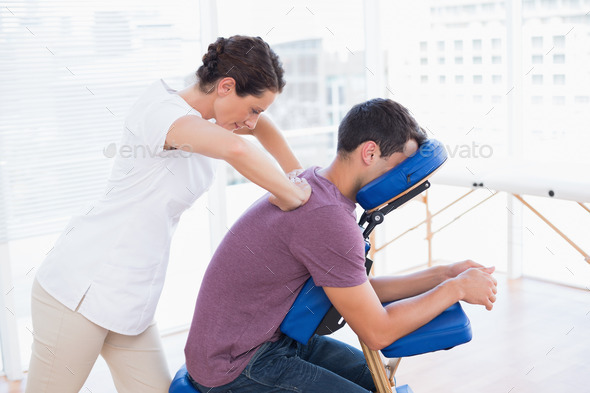 Man having back massage in medical office (Misc) Photo Download