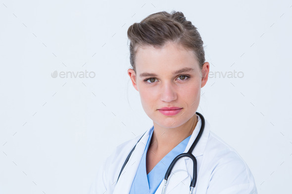 Smiling doctor looking at camera on white background (Misc) Photo Download