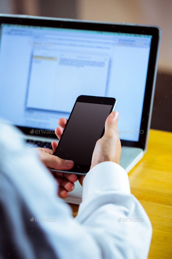 Man using laptop and smartphone in close up (Misc) Photo Download