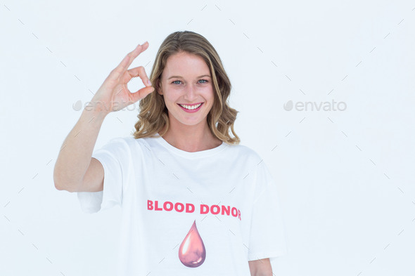 Blood donor showing okay sign on white background (Misc) Photo Download