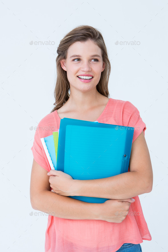 Smiling hipster holding notebook on white background (Misc) Photo Download