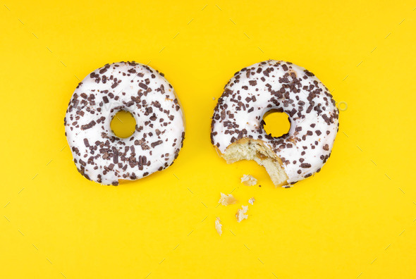 Top View of two donuts isolated on yellow background (Misc) Photo Download