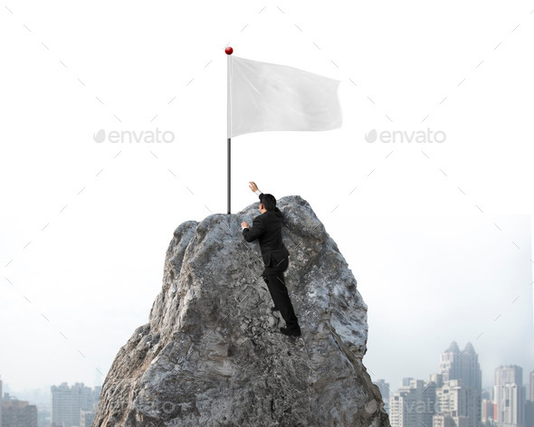 Businessman hand wanting for white flag on peak with cityscape (Misc) Photo Download