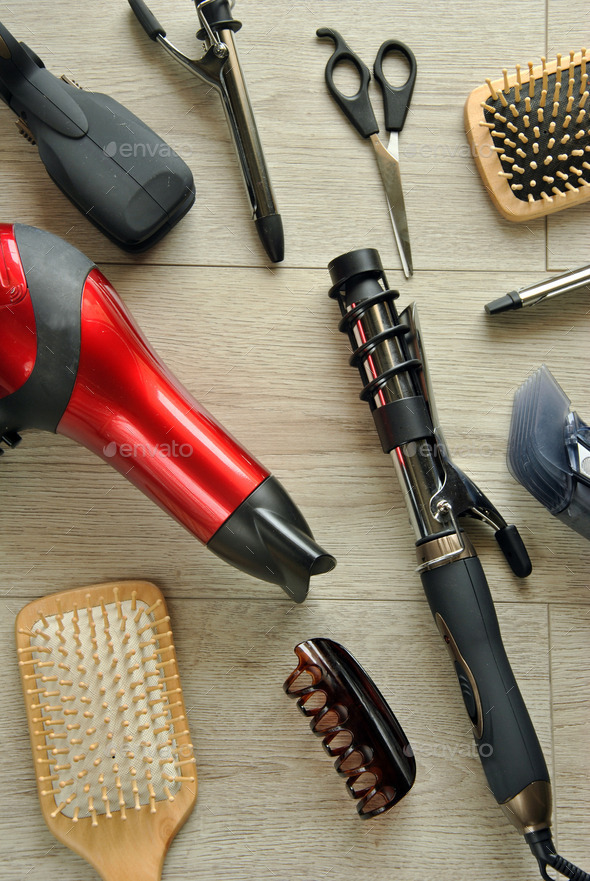 hairdressing tools on a wooden floor