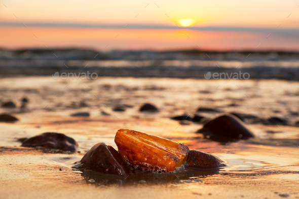 Amber stone on the beach. Precious gem, treasure. Baltic Sea
