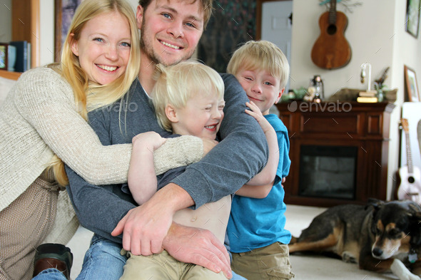 Happy Family Hugging in Living Room