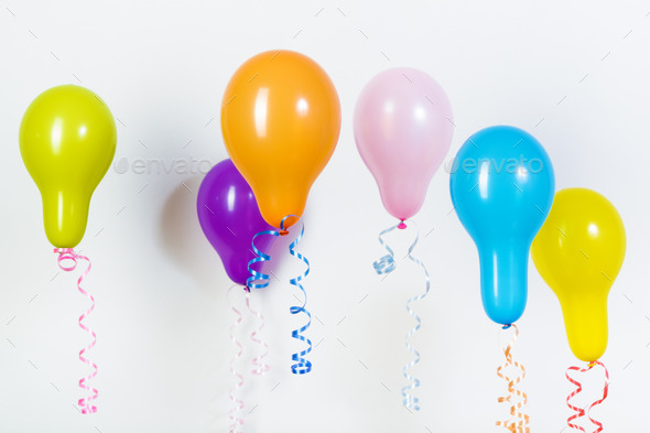 Balloons of different bright colors on a white background (Misc) Photo Download