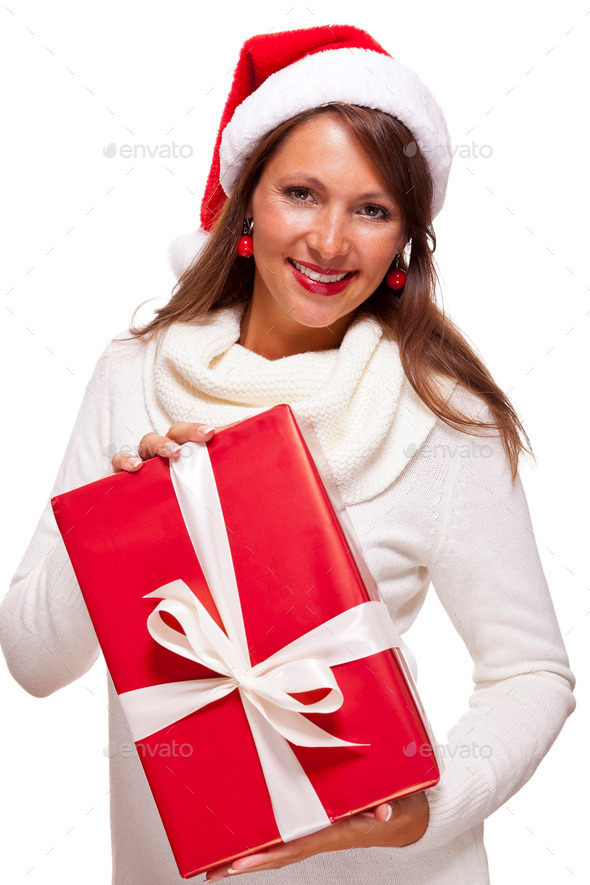 Pretty woman in a Santa hat with a large gift (Misc) Photo Download