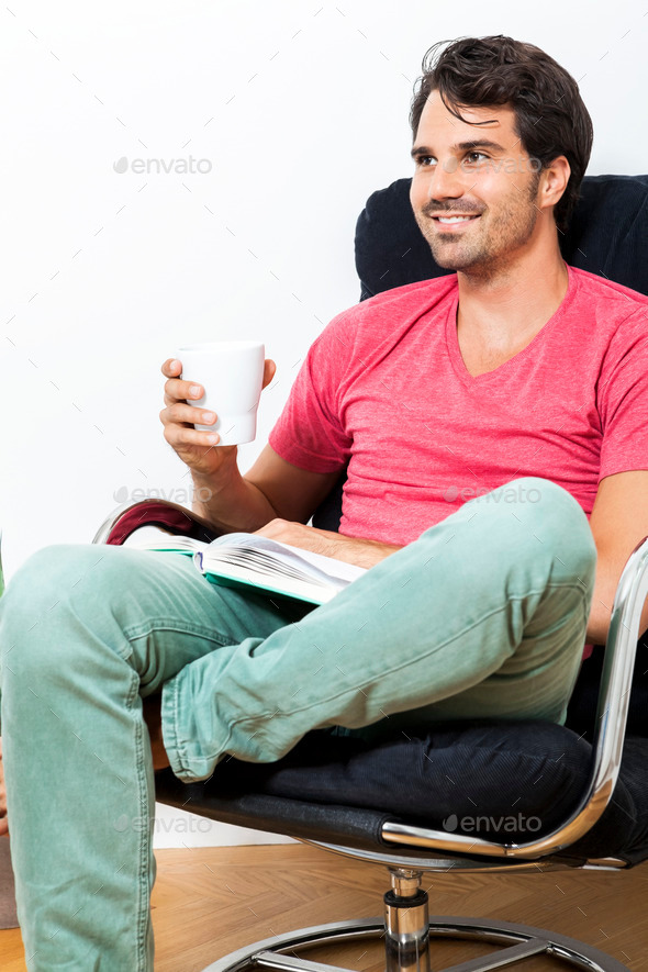 Man Sitting on Chair with Book and a Drink (Misc) Photo Download