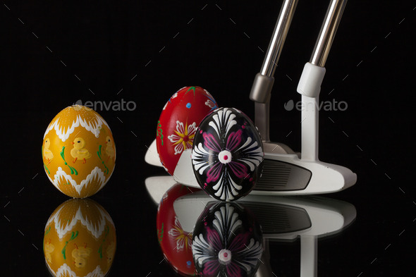 Two different golf putters and eggs (Misc) Photo Download