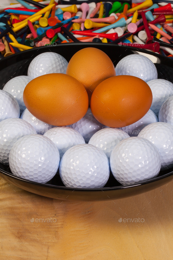 Golf balls and eggs on a black plate (Misc) Photo Download