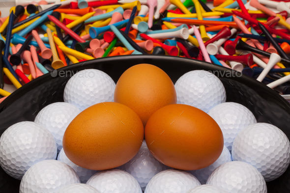 Golf balls and eggs on a black plate (Misc) Photo Download