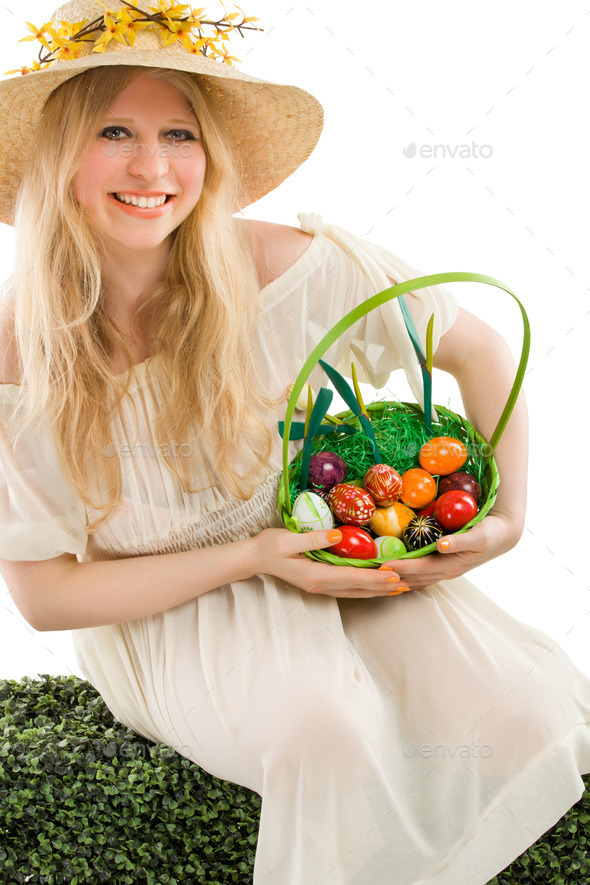 girl holding basket of colored eggs for easter (Misc) Photo Download