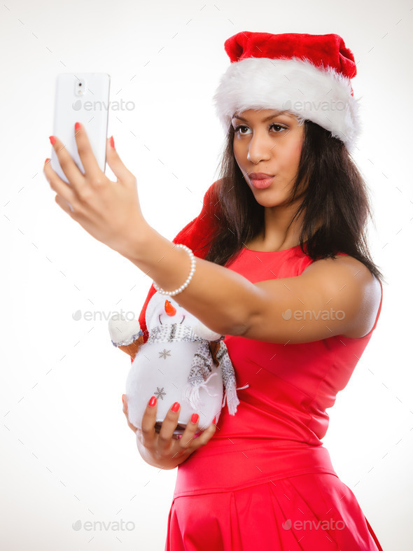 Girl holds snowman taking selfie (Misc) Photo Download