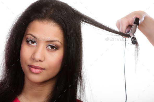 Girl hairdo with electric hair curler (Misc) Photo Download