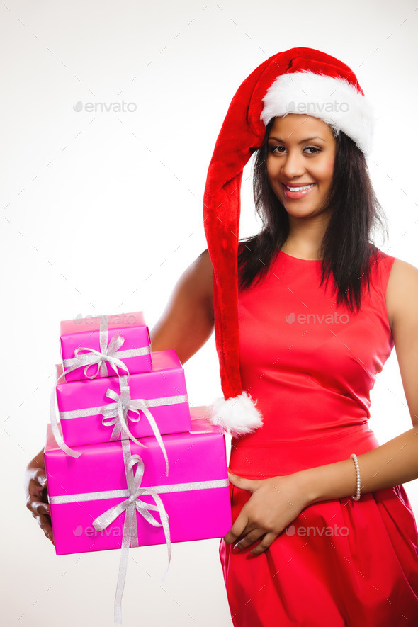 Woman santa helper hat holds gift boxes (Misc) Photo Download