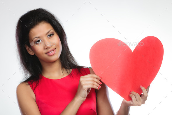 Girl mixed race with paper red heart (Misc) Photo Download