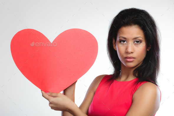 Girl mixed race with paper red heart (Misc) Photo Download