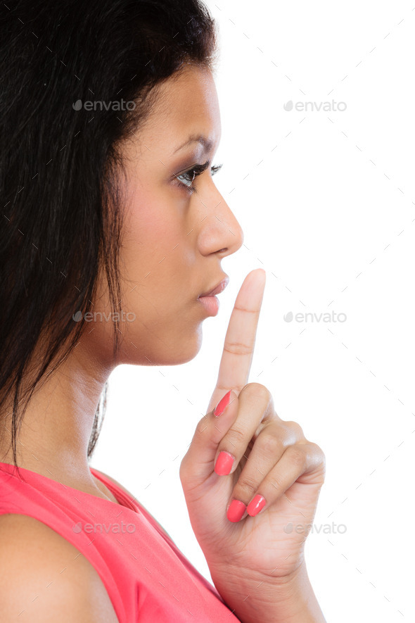 Secret woman. Girl showing hand silence sign (Misc) Photo Download