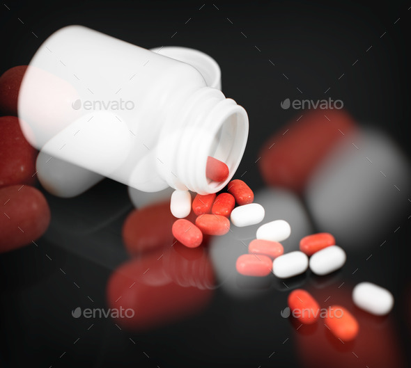 Red and white pills spilled from bottle.