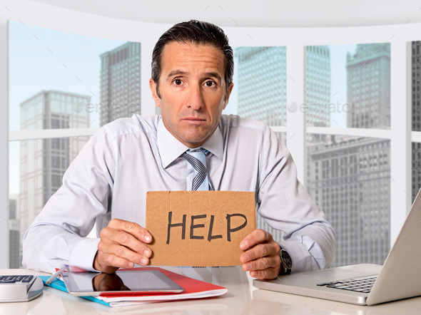 desperate senior businessman in crisis asking for help at office in stress