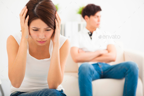 young Couple not talking after fight in living room