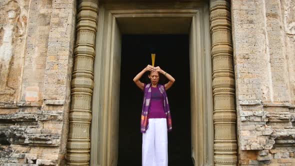 Female Buddhist Praying With Incense In Temple Doorway Angkor Wat Temple Cambodia 3 Female Buddhist Praying With Incense In Temple Doorway Angkor Wat Temple Cambodia 3