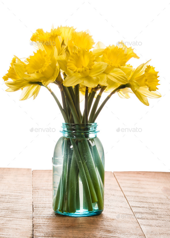 Bouquet of yellow daffodil flowers in a jar