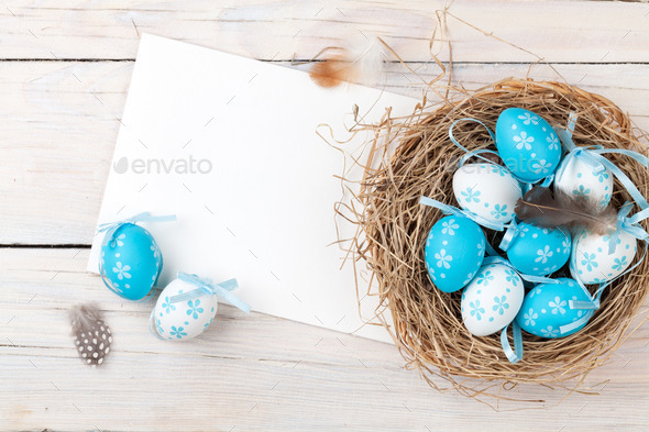 Easter background with blue and white eggs in nest and greeting (Misc) Photo Download