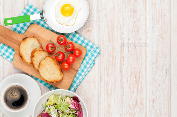 Healthy breakfast with fried egg, toasts and salad (Misc) Photo Download