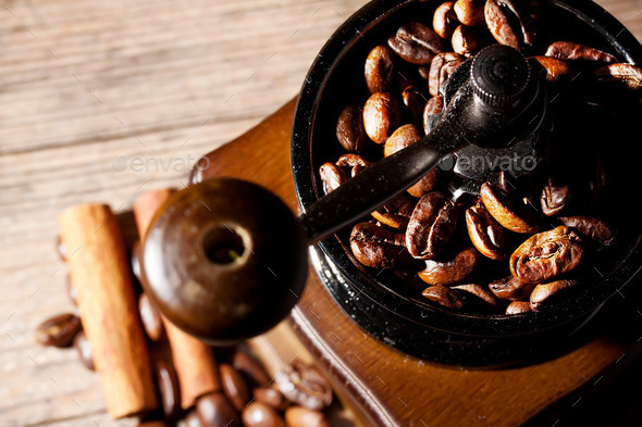 Coffee grinder with beans on the wooden background (Misc) Photo Download