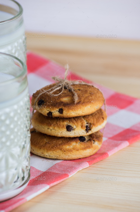 cup of milk with oatmeal cookies and napkin (Misc) Photo Download