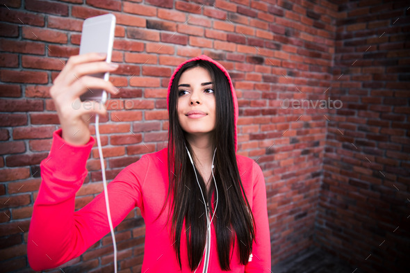 Happy young sportive woman making selfie photo (Misc) Photo Download
