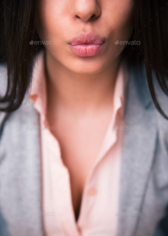 Closeup image of a female lips giving kiss (Misc) Photo Download