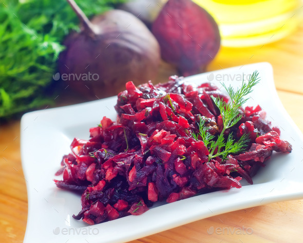 Fresh salad with beet and walnuts on white plate (Misc) Photo Download