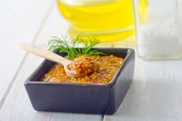 Mustard in the black bowl on table (Misc) Photo Download