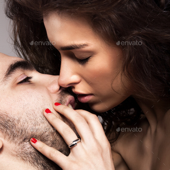 Romantic couple touching and kissing each other