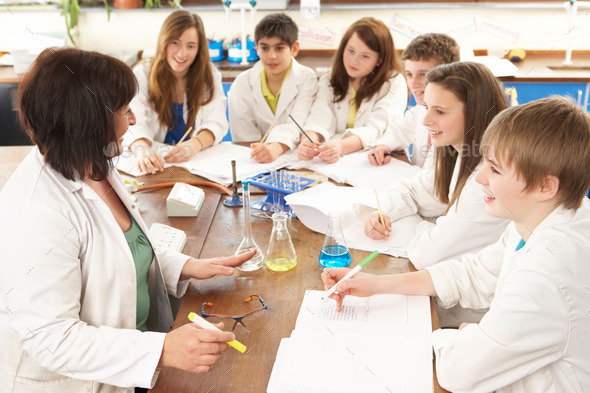 Group Of Teenage Students In Science Class With Tutor (Misc) Photo Download