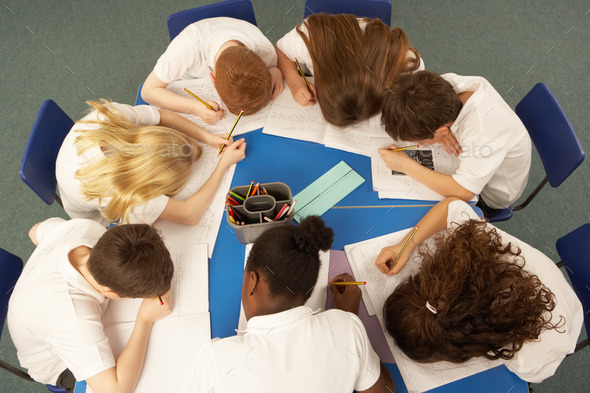 Overhead View Of Schoolchildren Working Together At Desk (Misc) Photo Download