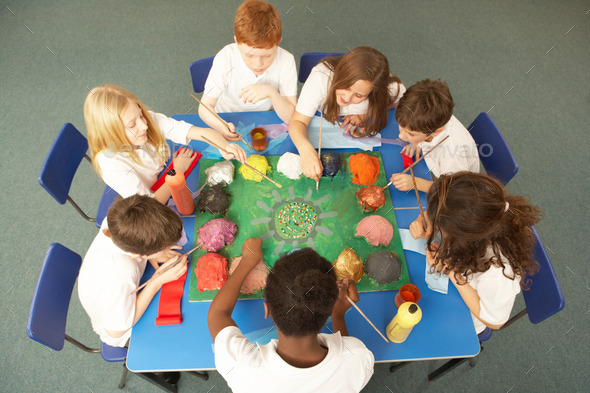 Overhead View Of Schoolchildren Working Together At Desk (Misc) Photo Download