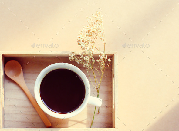 Black coffee and spoon on wooden tray with dried flower, retro f (Misc) Photo Download