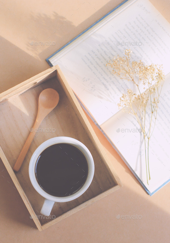 Black coffee and spoon on wooden tray with book, retro filter ef (Misc) Photo Download