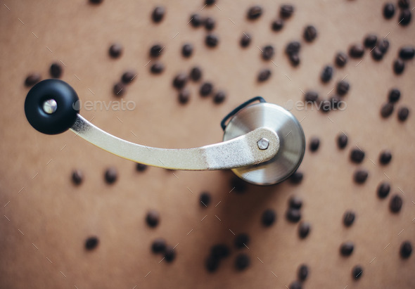 Top view of coffee grinder on coffee beans with retro filter eff (Misc) Photo Download