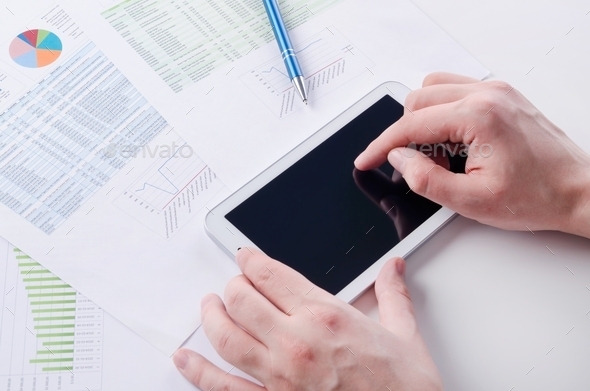 Businessman working with digital tablet. Report charts on desk (Misc) Photo Download